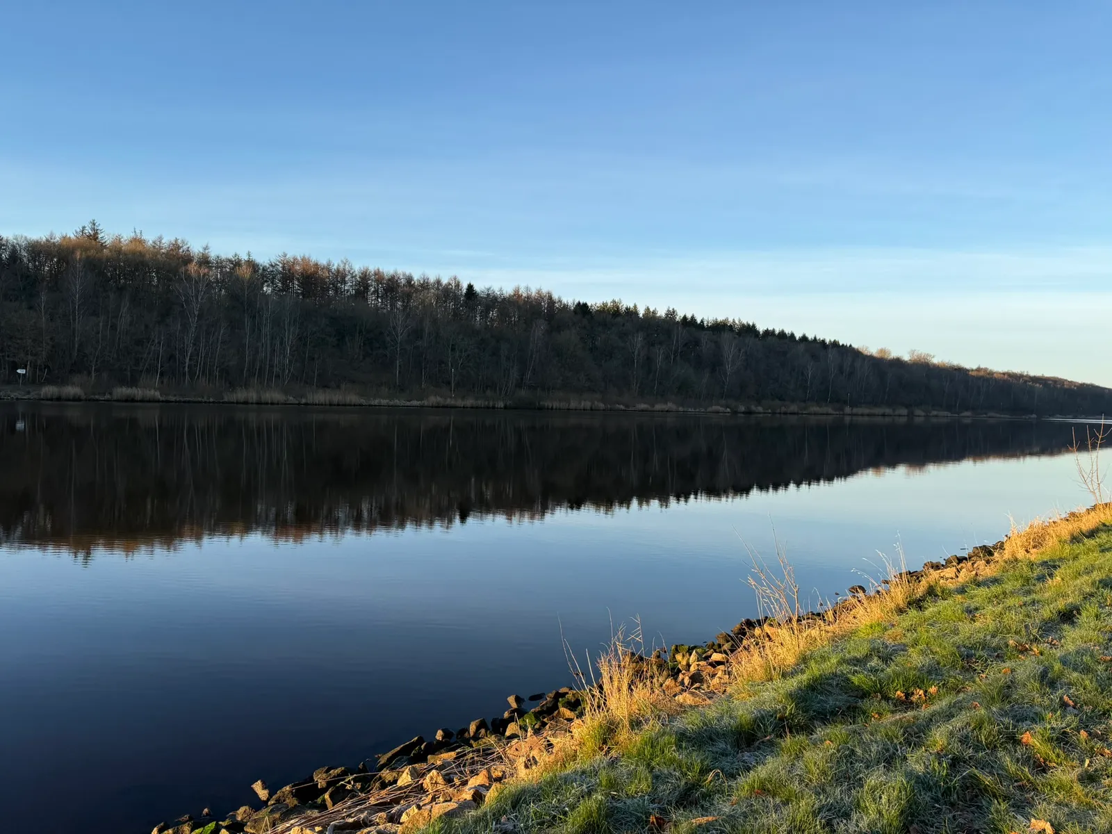 Calm water on the Kiel Canal in the evening light